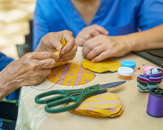 residents sewing together