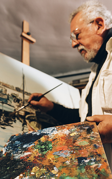 artist painting on a canvas