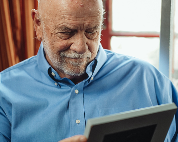 man-looking-at-photographs