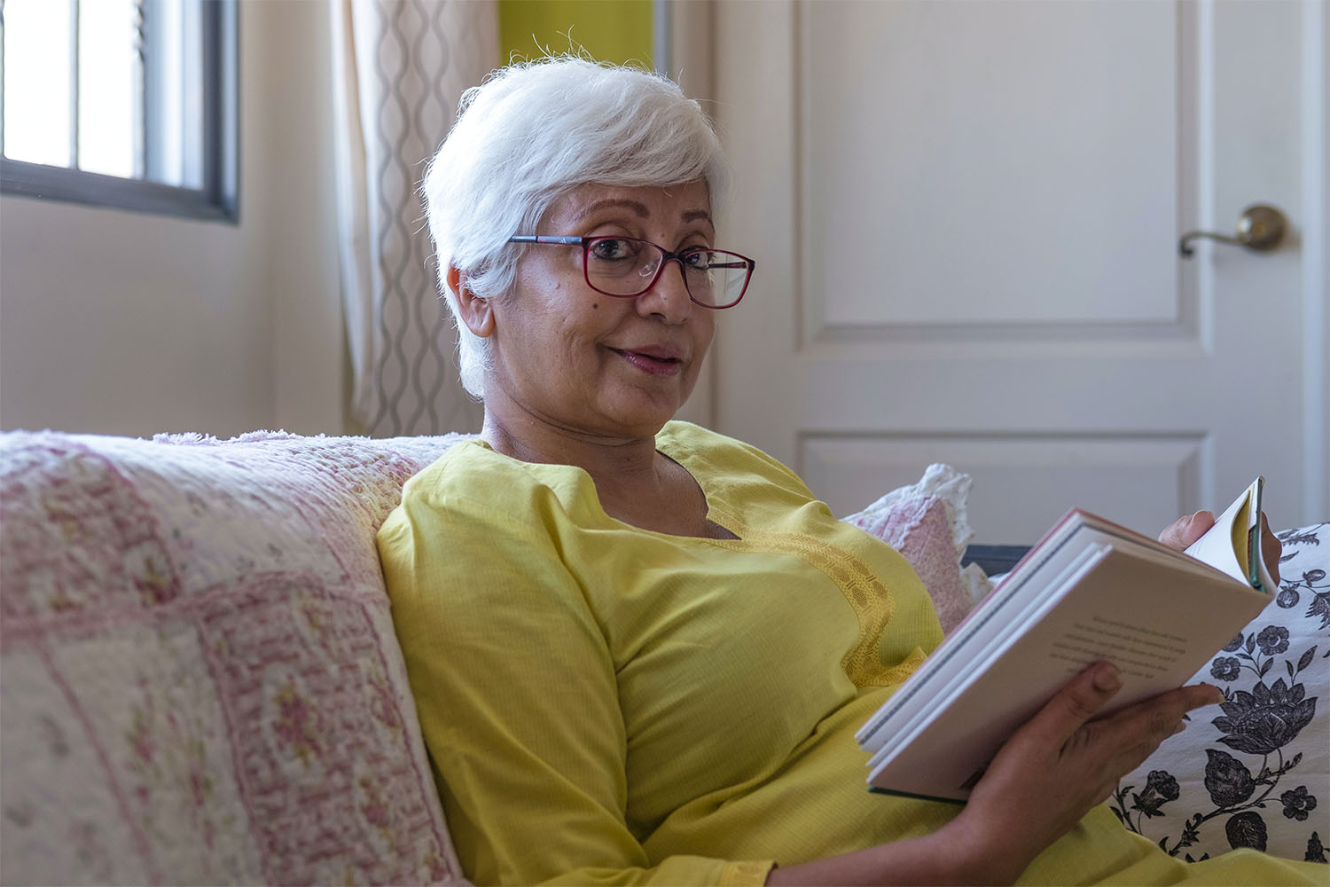 woman-reading-a-book-in-her-room