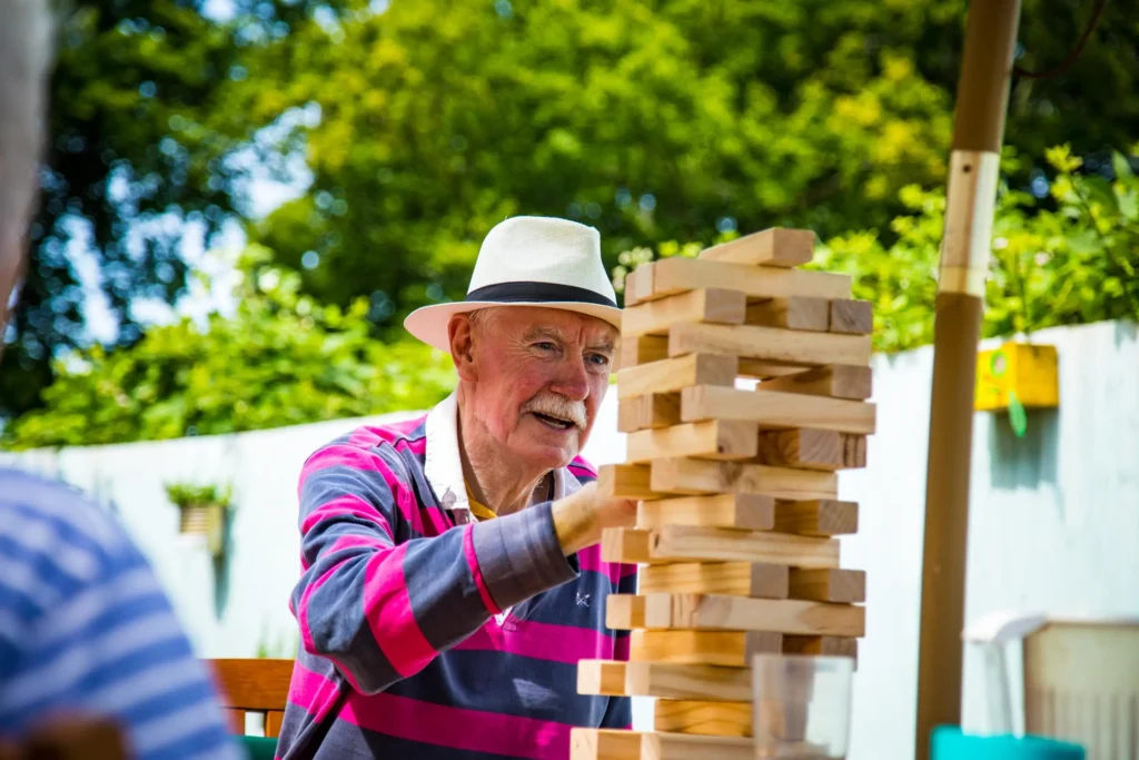 Resident-playing-jenga-outside